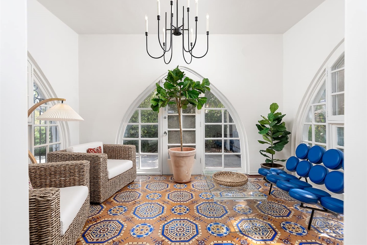 Morning coffee and soft light in the home’s sun-filled sitting room.
