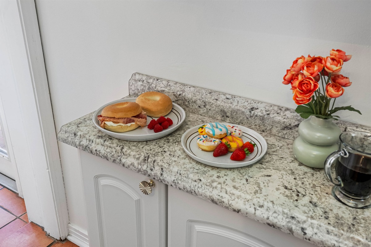 A clean, inviting space with rich tile flooring and stylish finishes that make it a favorite spot for morning coffee or evening appetizers.