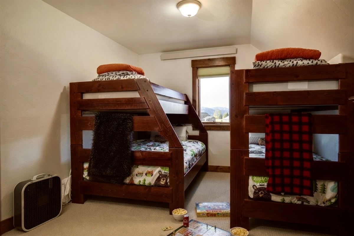 Even with many bodies, this room stays comfortable with a window that provides fresh mountain air, and a portable fan for both white noise and a comfortable breeze.  Sweet dreams are had here.