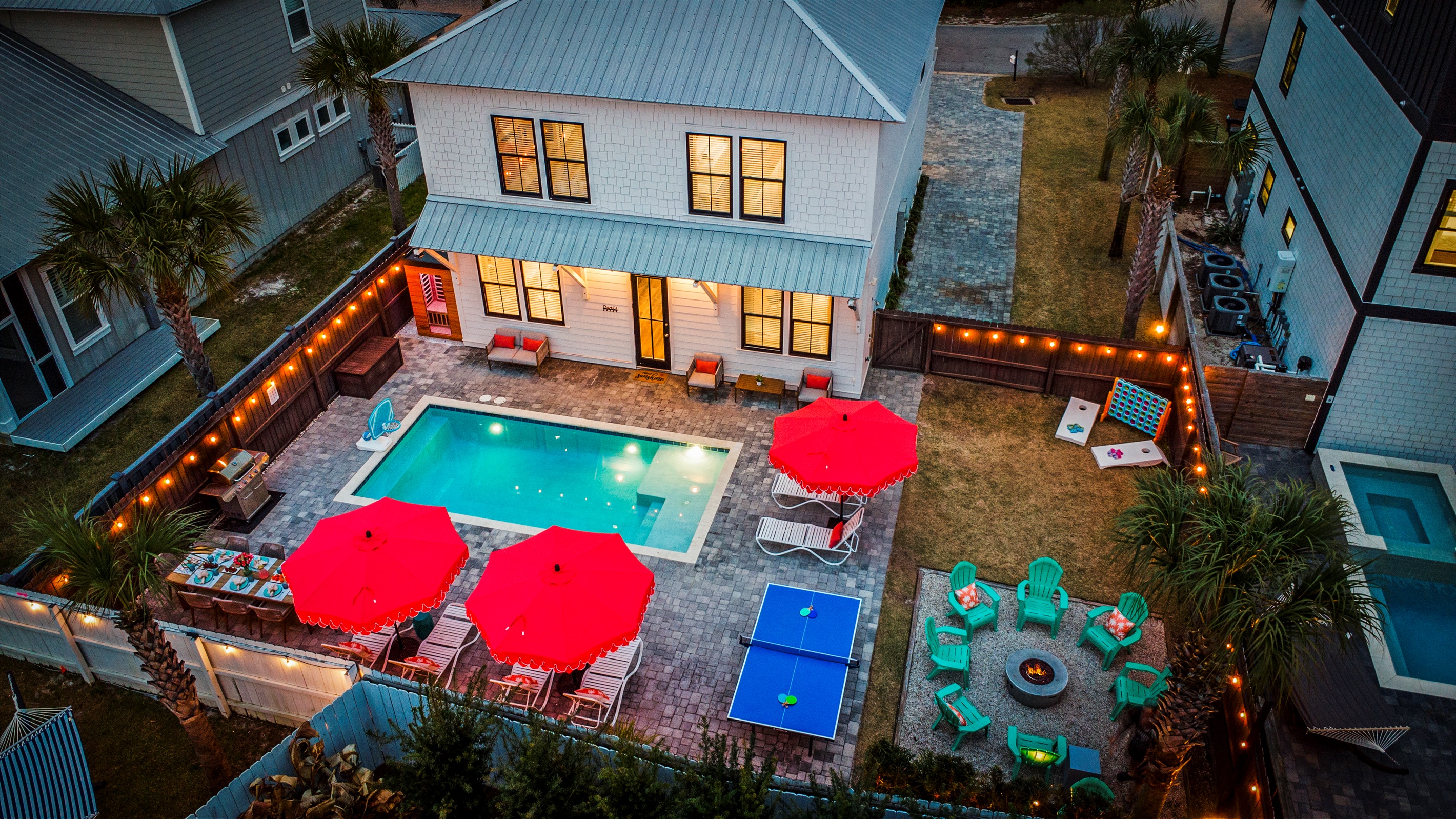 Twilight pool swims, fire pit conversations, and warm Florida evenings in your own private backyard retreat.