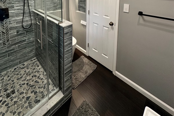 Side View: Bathroom Shower and Linen Closet