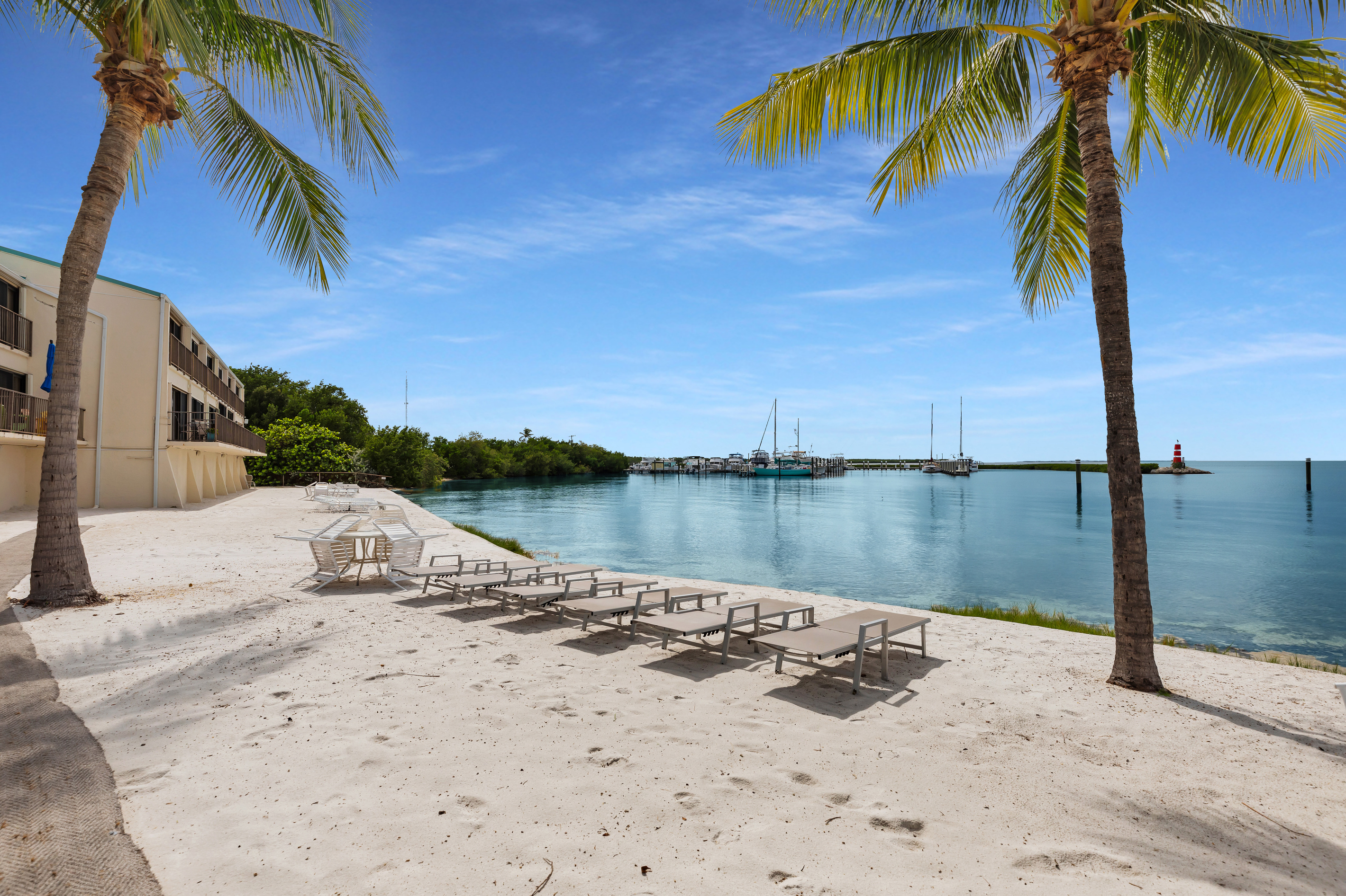 Sandy beach with lounge chairs overlooking the crystal clear Florida Bay. Enjoy a world famous Florida Keys sunset each night!