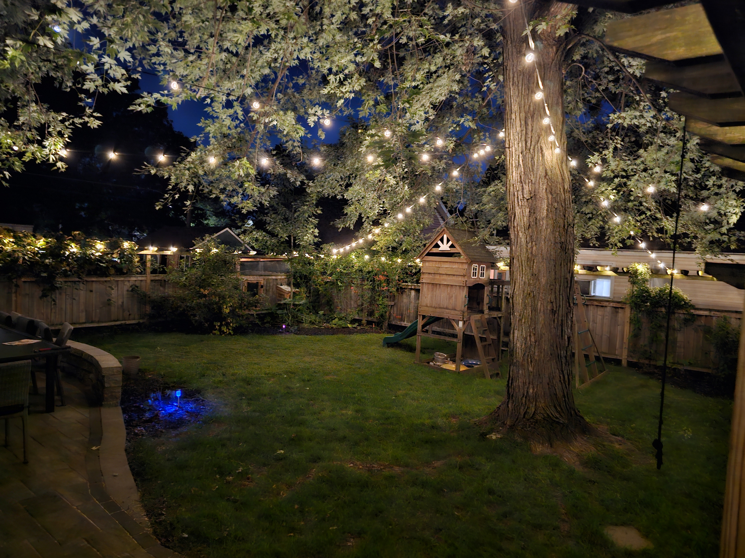 Enjoy the private fenced yard that is beautifully lit up at night.