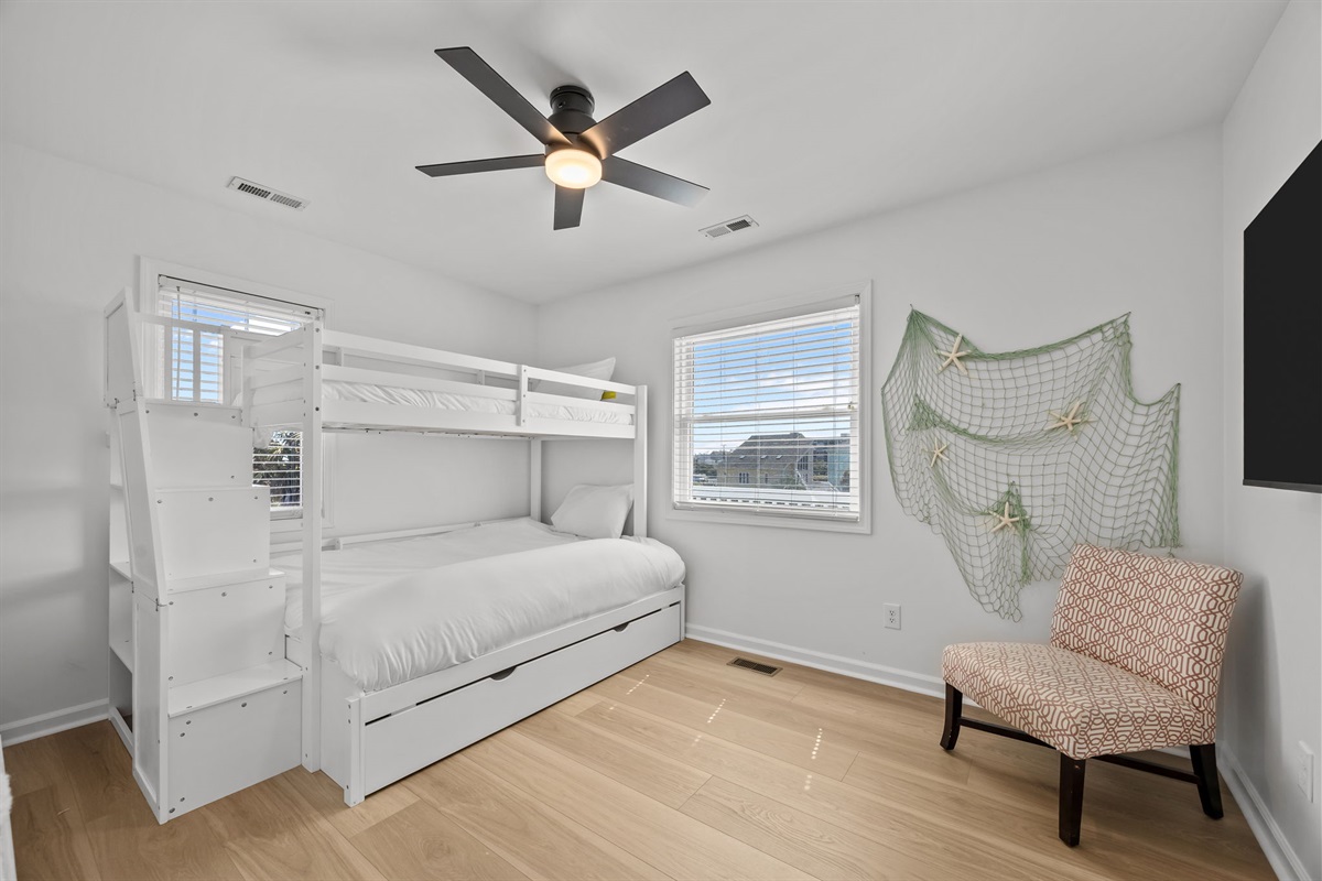 Second floor kids room with bunk bed and trundle for extra sleeping space