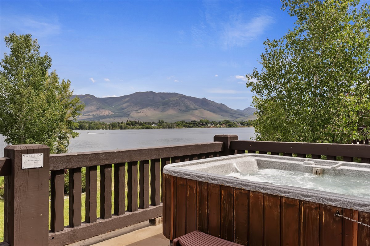 Elevated deck views featuring your private hot tub and serene mountain backdrop—luxury relaxation at its finest.