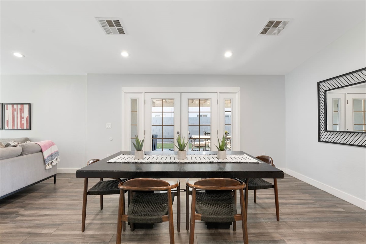 Spacious dining area featuring a stylish 6-seater table, perfect for family meals and gatherings.
