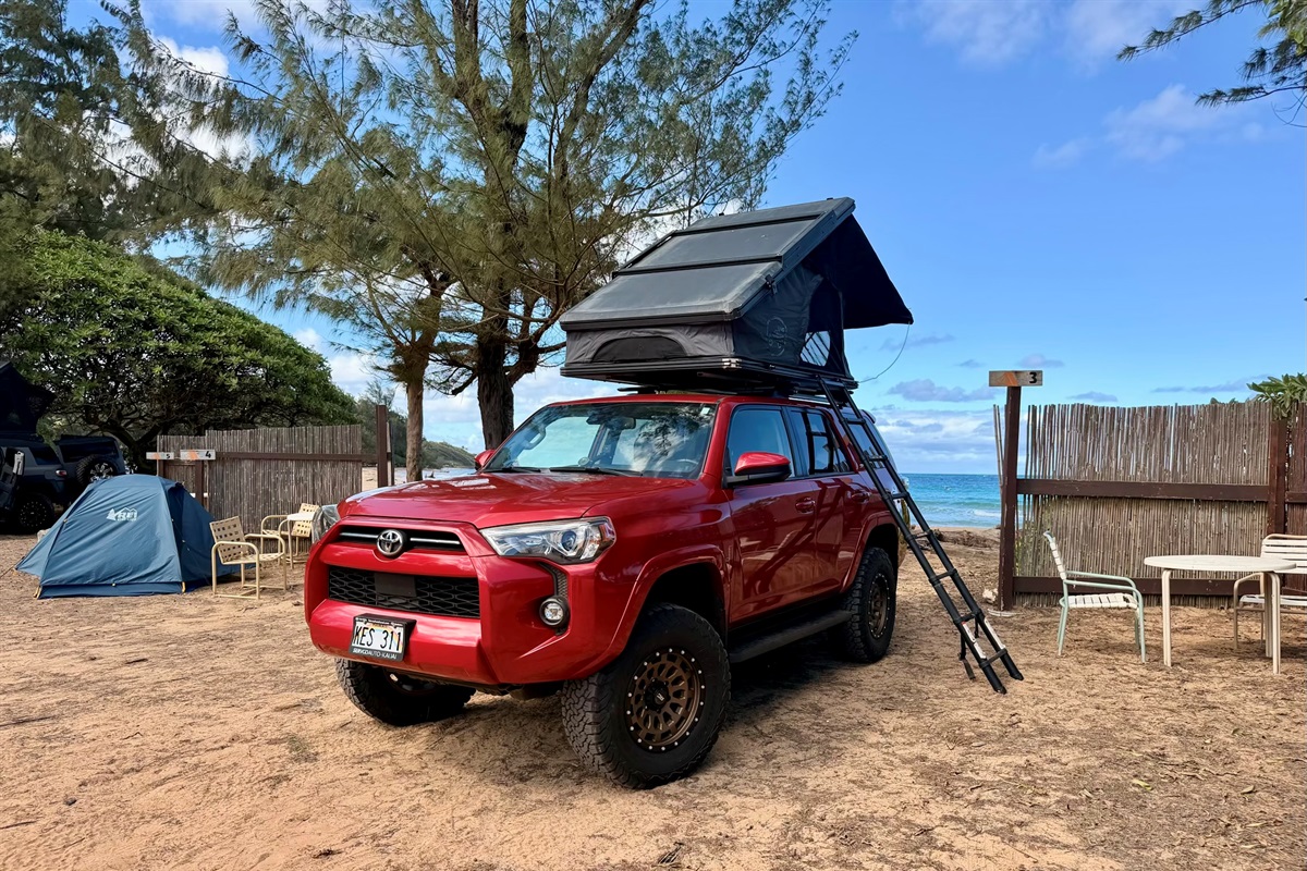 Red Toyota 4Runner rooftop camper rental on Kauai