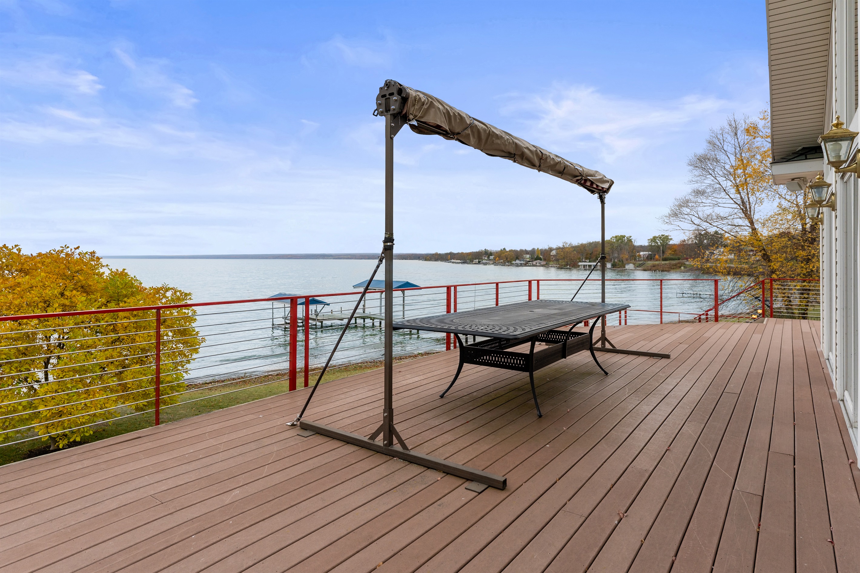 Large outdoor table for alfresco dining with sun shade for convenience