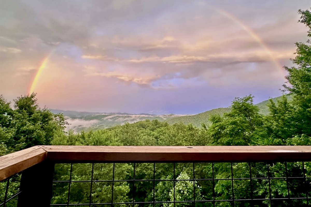Rainbow view from our main floor deck! Thank you to our awesome guest, Maria, who shared this with us!