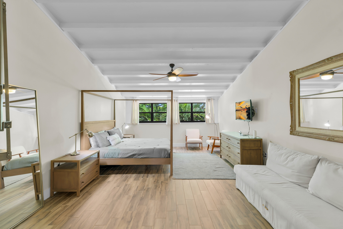 Upstairs primary bedroom includes a king bed and loft bedroom access