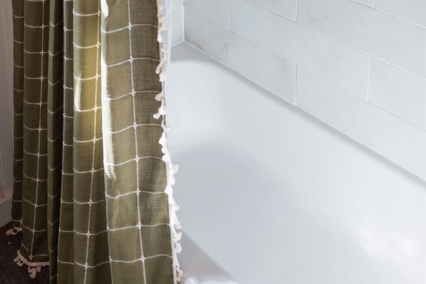 A refreshed bathroom with clean lines and modern comfort &mdash; your own quiet space to reset.