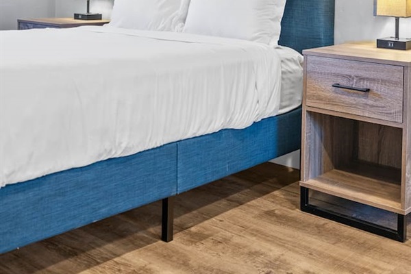 Retreat to this stylish bedroom featuring a comfortable bed and elegant lamp. Designed for ultimate relaxation, this cozy space offers the perfect blend of charm and comfort for a restful stay!