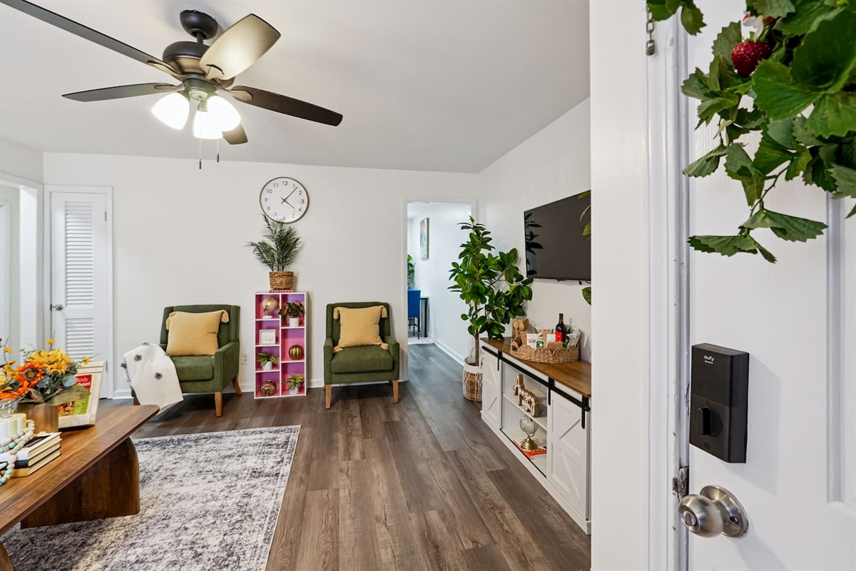 The living room features cozy furniture, including a comfortable blue couch, and an Amazon Fire-powered Smart TV for your entertainment. You’ll also find the Xfinity modem conveniently located here, convenient for ethernet connection.
