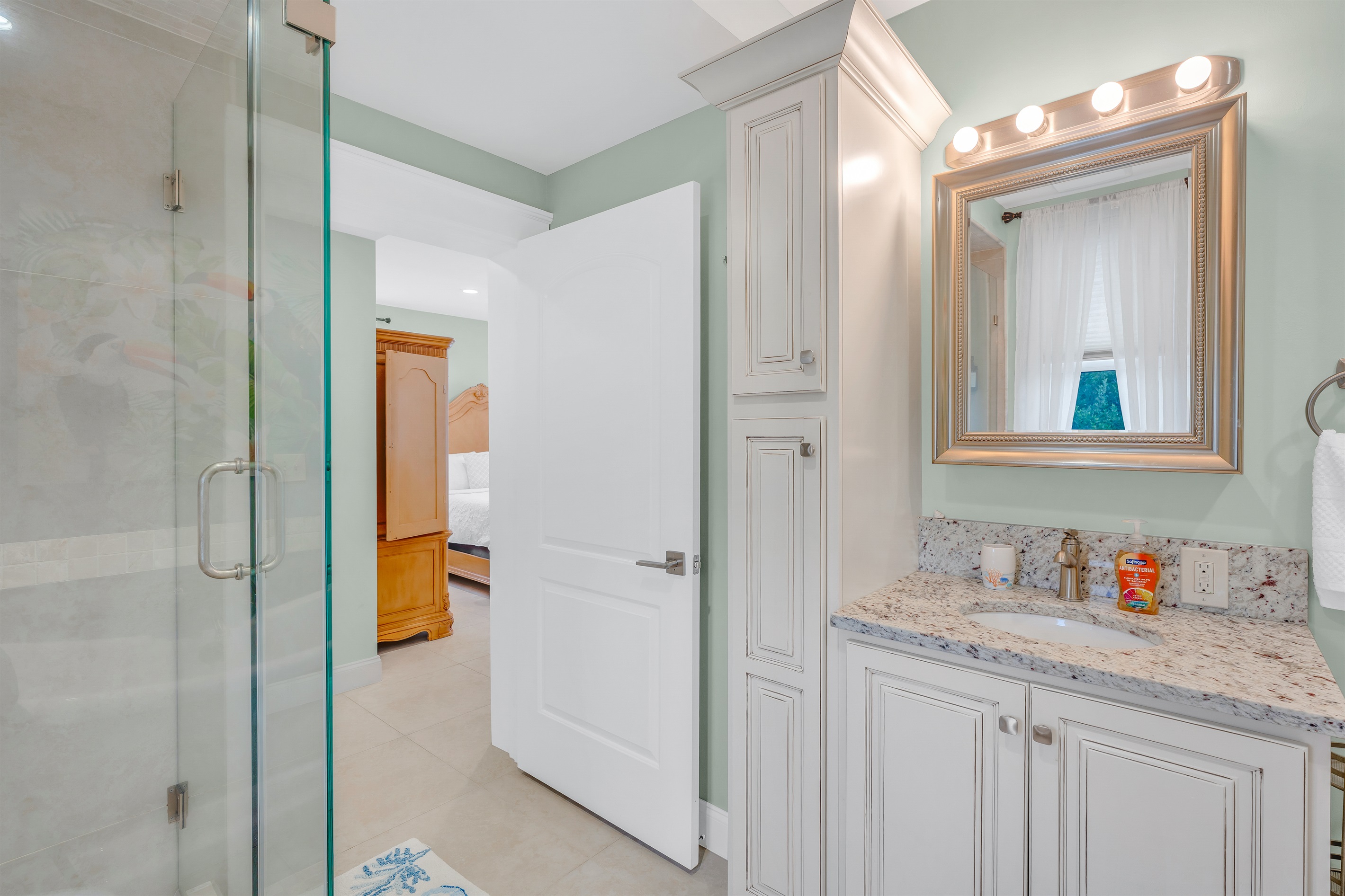 The ensuite primary bathroom has a stand up shower,