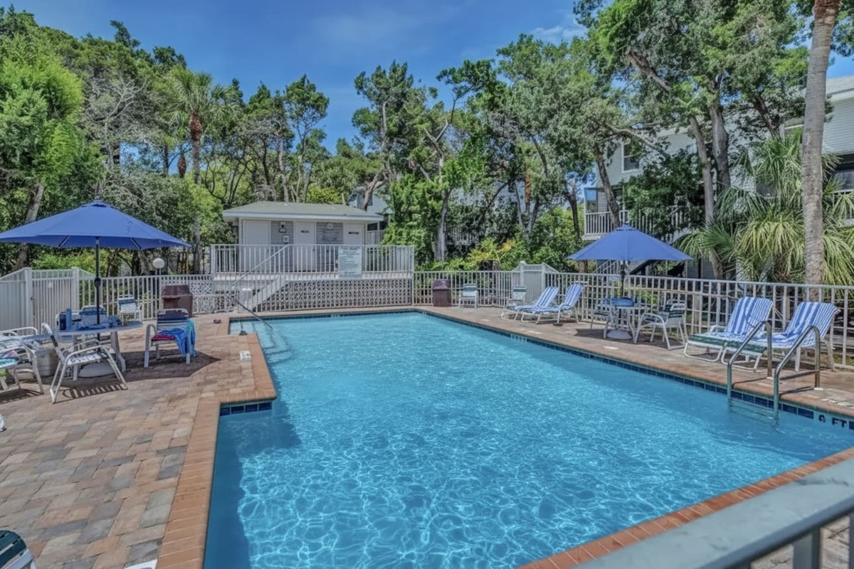 Enjoy the best of island living with access to our seasonally heated pool, just steps from our home. Shared with the other homes in the peaceful complex, the inviting pool is a wonderful spot to cool off and soak up some sun! 