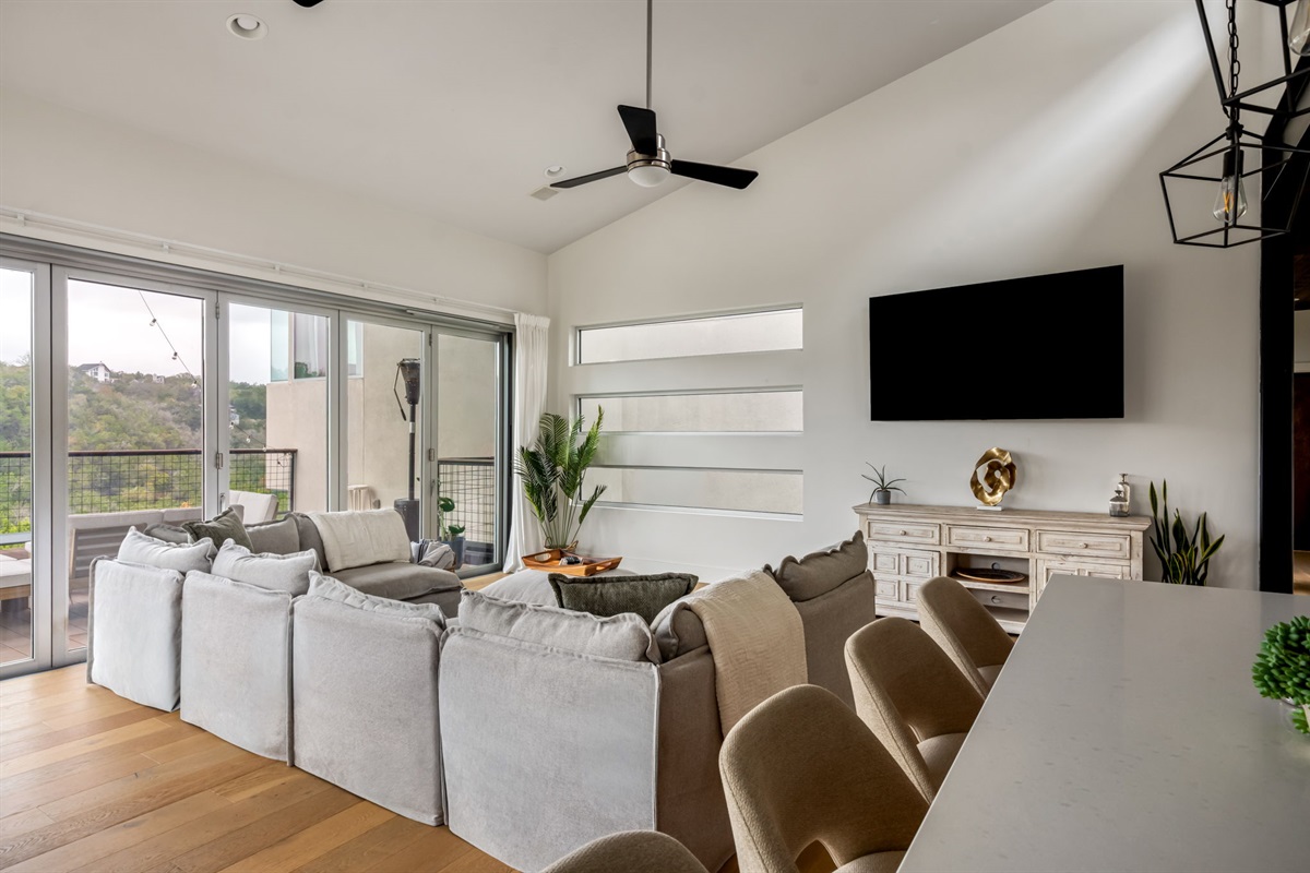 Relax and unwind in this spacious living room with comfy seating and a smart TV