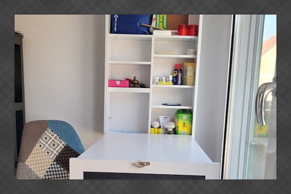 Converted desk workspace, location of the First Aid Kit and other emergency supplies