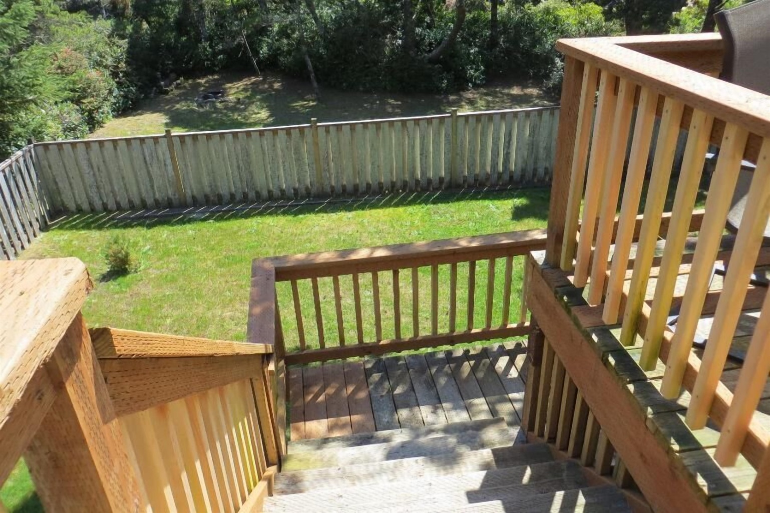 second floor south deck and fenced yard