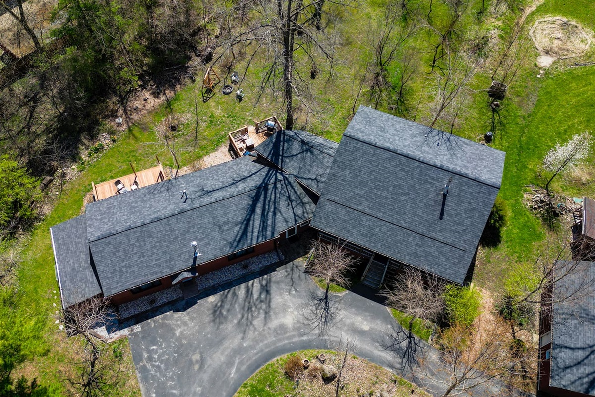 Log cabin is on the right.Property has guest quarters that are attached to the cabin via a shared sunroom.