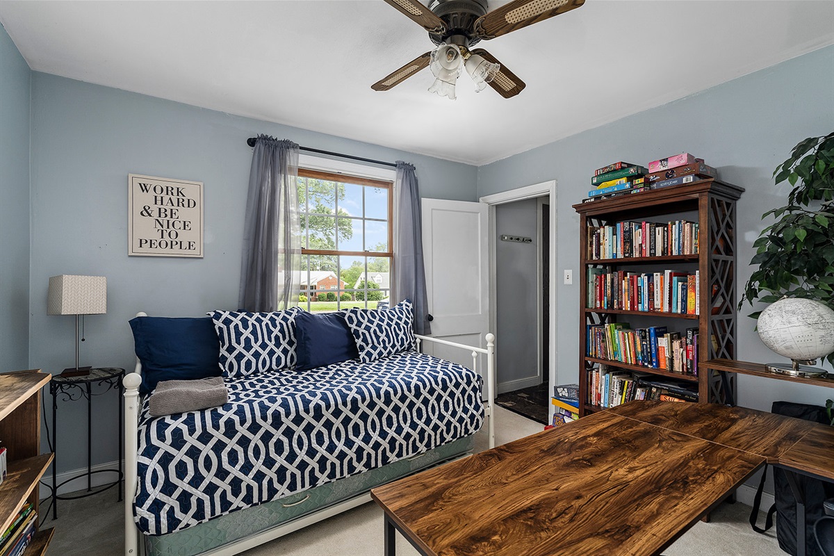 Office: Relax on a stylish daybed with literary treasures and sunlit views!