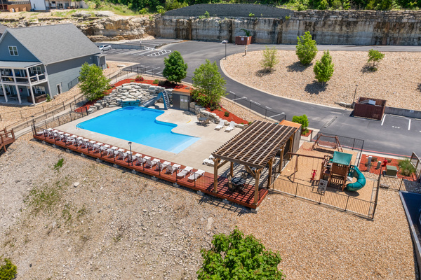 Outdoor pool and playground. Literally right next to our lodge! Beach entry and lots of lounging space. Open from May through September (ask about exact dates.)