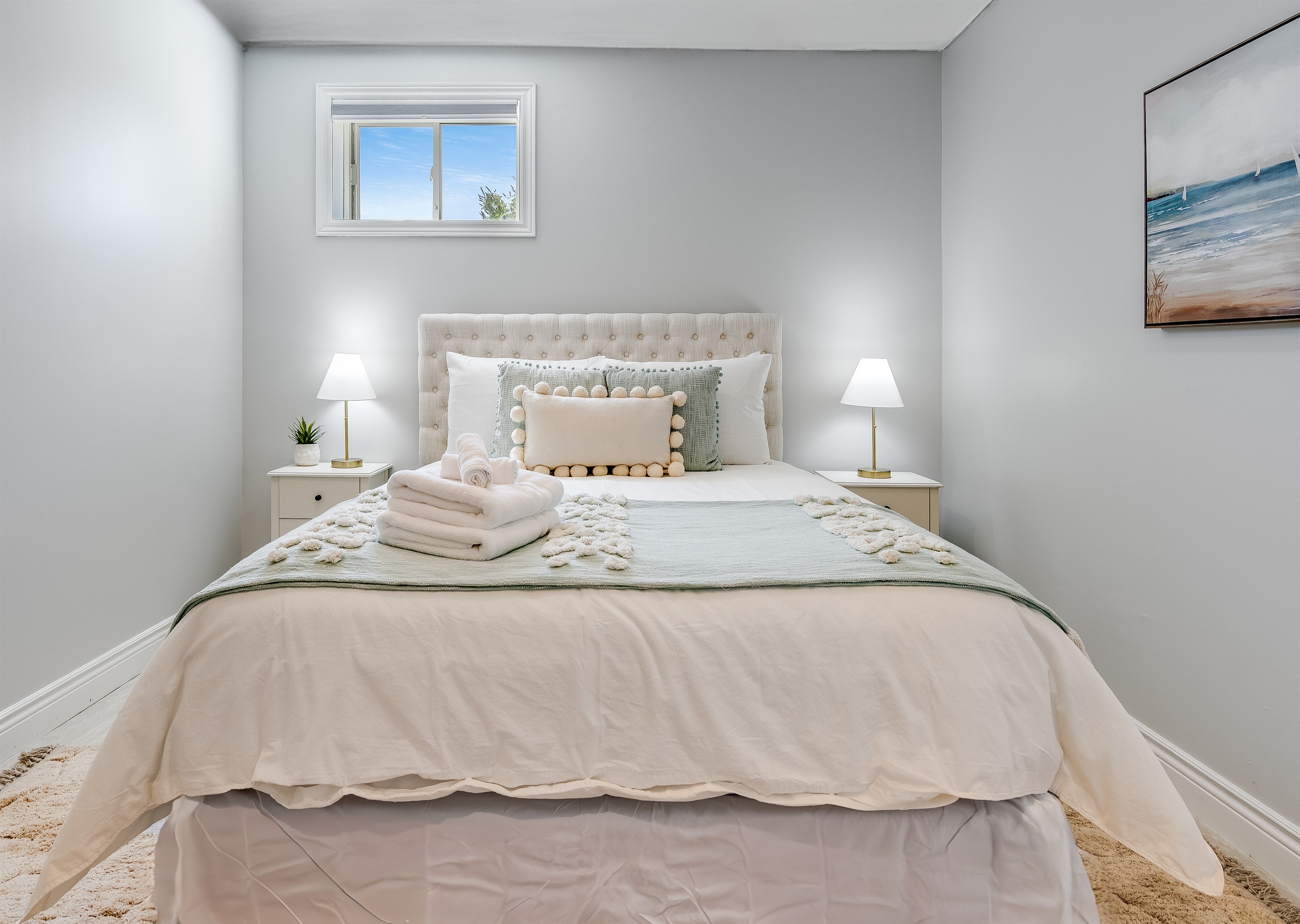 A Queen bed, with perfect welcoming colours.