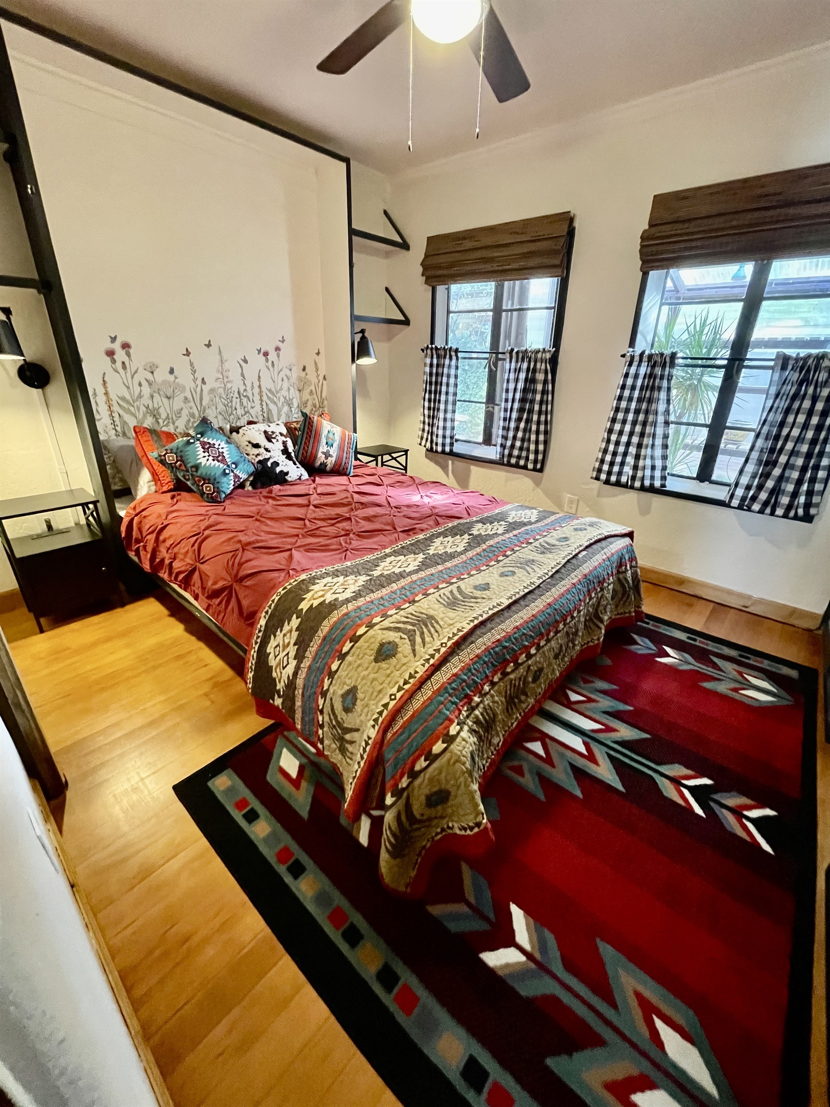 Wake up to garden views in this cozy queen bed with southwestern charm.