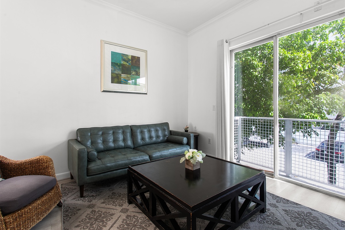 Sliding glass doors open for sea breeze and fresh air, especially nice in winter