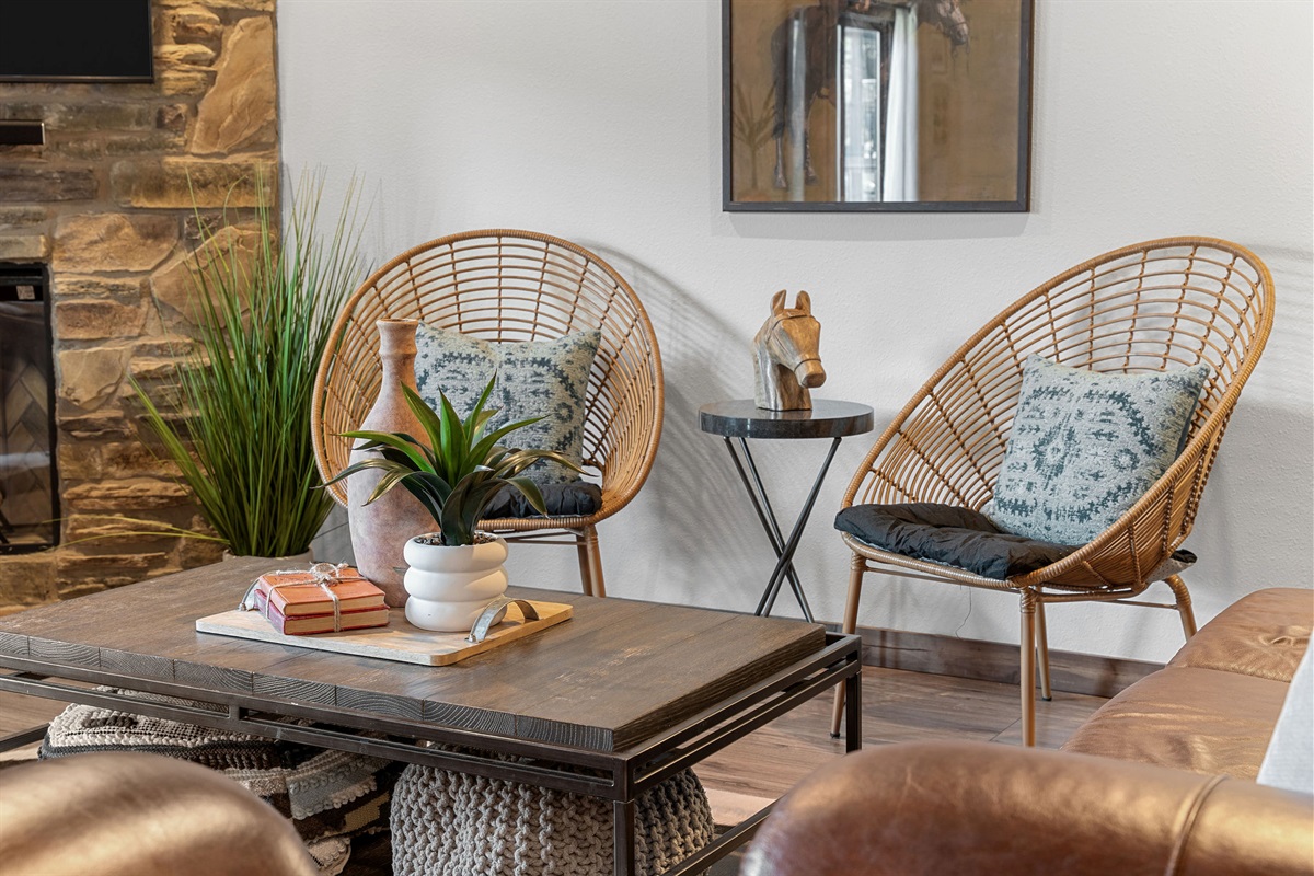 Cozy seating  with woven chairs and rustic touches—perfect for morning coffee or winding down by the fire ☕