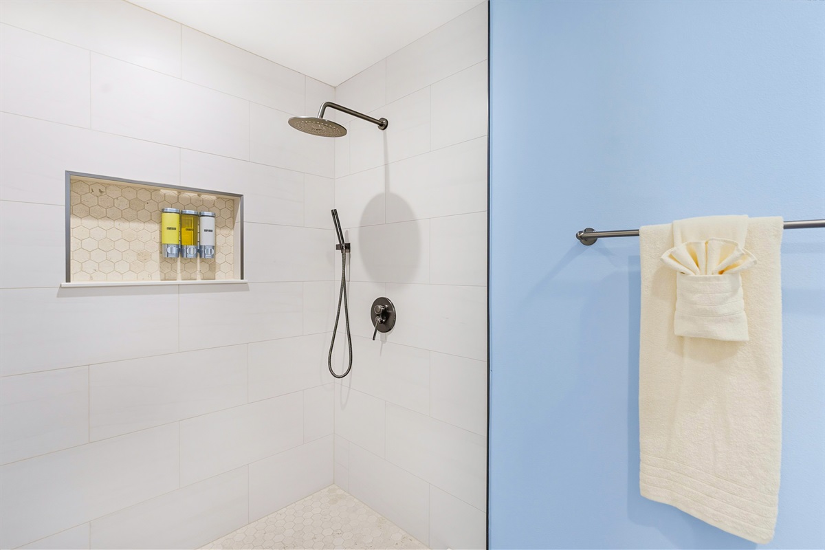 The master bedroom offers a full en suite bathroom and laundry room.