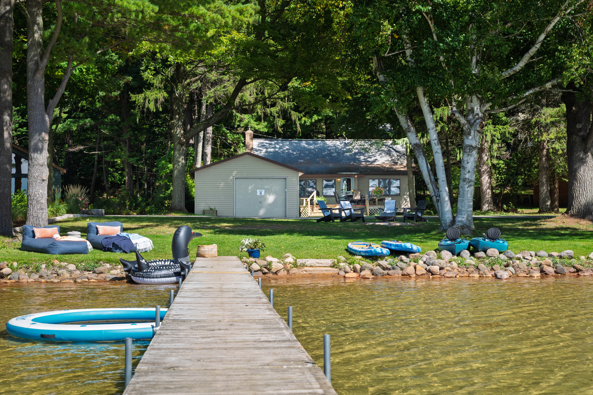 Enjoy 100' of gorgeous sandy bottom from your private dock on Lake Ann from The Loons' Nest. Plenty of room for chilling, splashing, kayaking, paddling or just floating.
