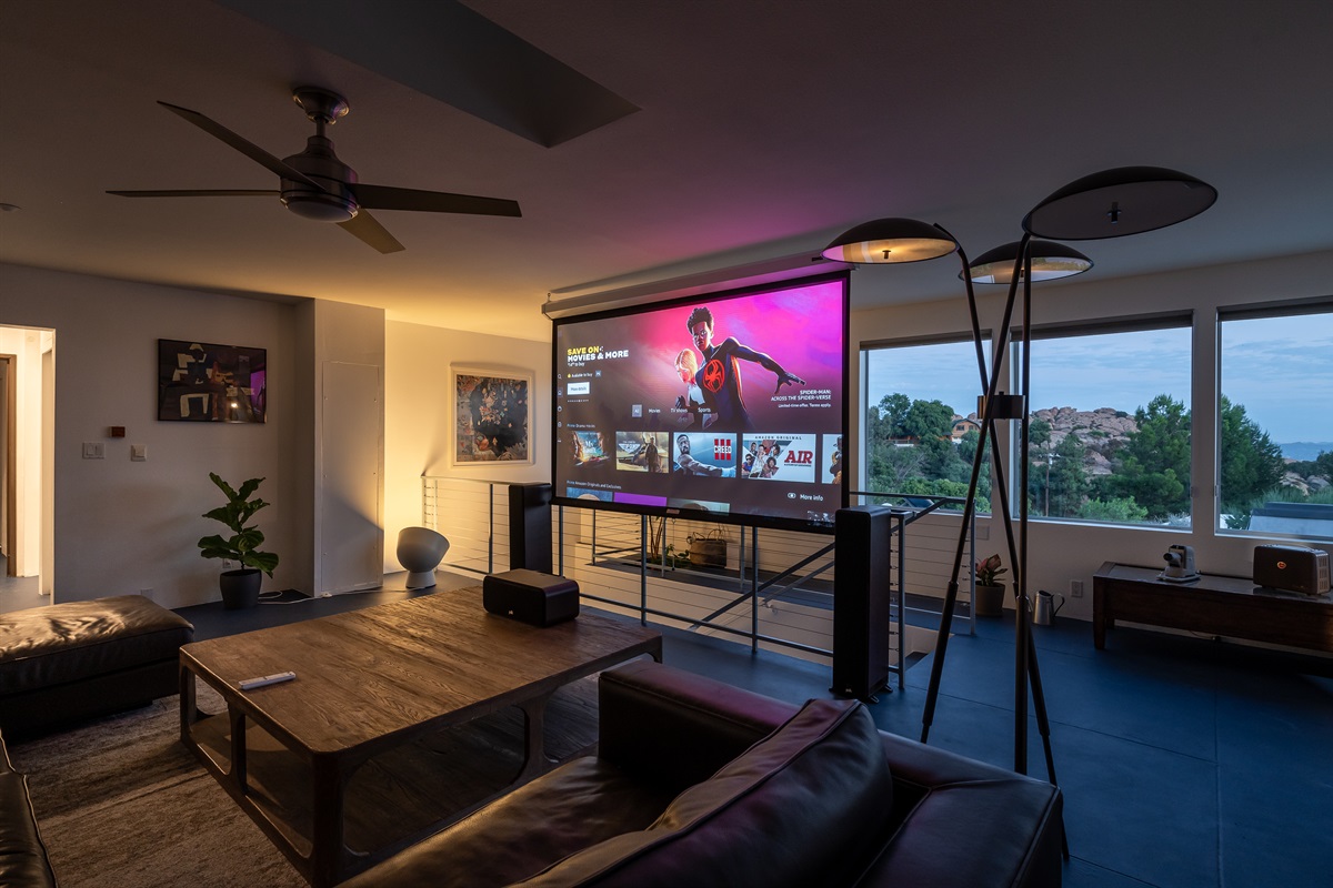 upstairs living area converts to Home Theater with HD projector and Yamaha+Polk sound system 