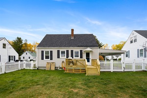 Backyard point of view with wood deck