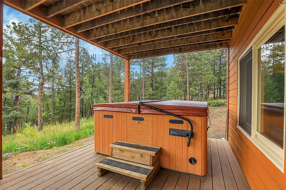 Soak away your stress in the private outdoor hot tub while taking in the crisp mountain air and surrounding nature.