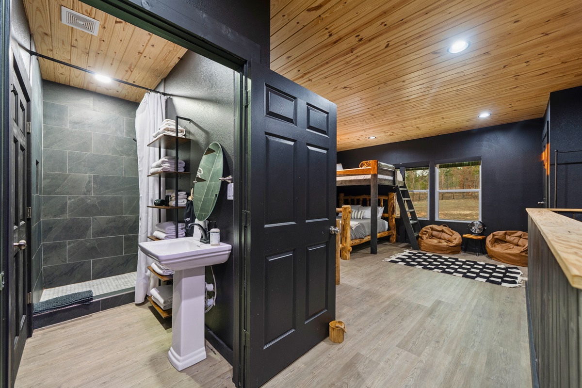 The bunk area includes thoughtful storage and easy access, making it both functional and inviting.