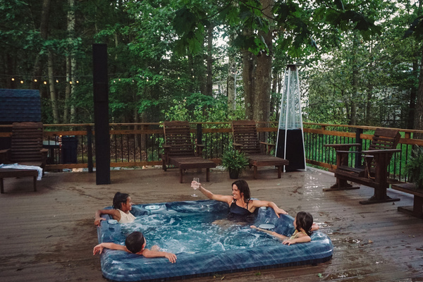 Create great memories with loved ones in our 7 person hot tub and wrap around deck.