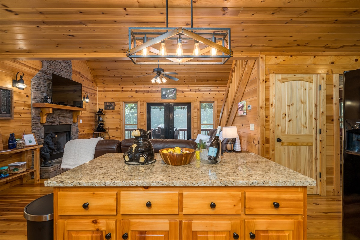 View upon entering the cabin, wonderful open floorplan with lots of daylight and access to the screened in porch with BBQ grill. 
