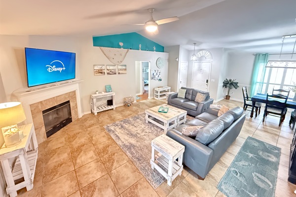Our main living room featuring a 65" 4K HDR Roku TV, Leather furniture, and plenty of board game space. Bring the streaming credentials.