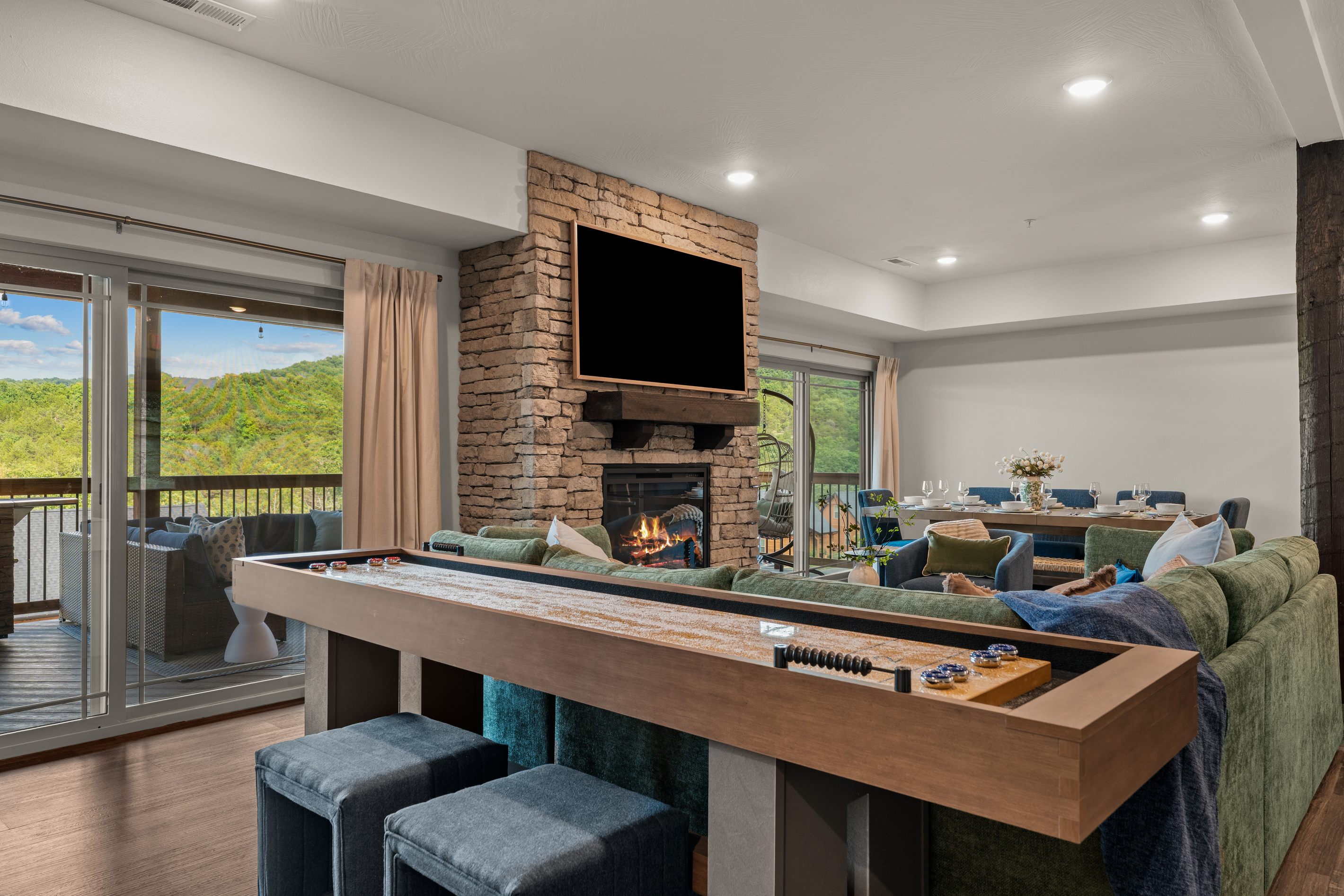 Slide a puck on the full-size shuffleboard table. With the two sliding deck doors, it's easy to get outside to relax and enjoy even more!