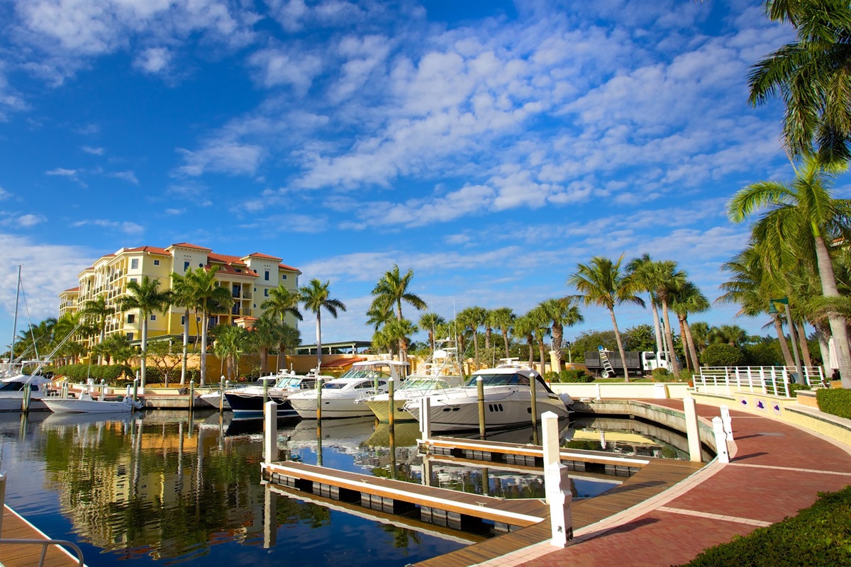Elegant yachts and palm-lined promenades set the scene at Jupiter's exclusive Marina. A serene oasis where luxury meets coastal charm beneath endless blue skies
