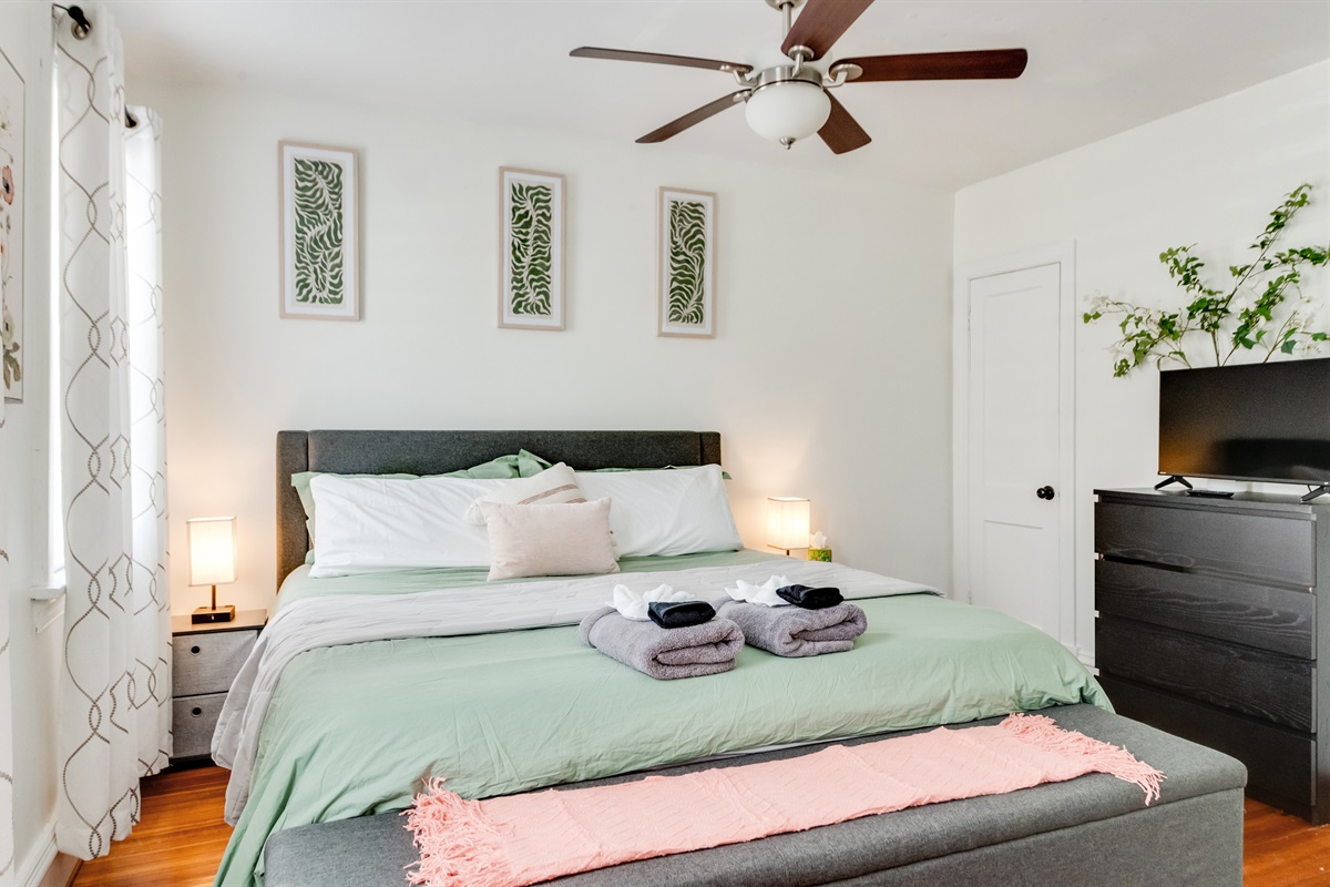 King Bedroom 2: Relax in style with plush linens, chic decor, and soothing natural light!