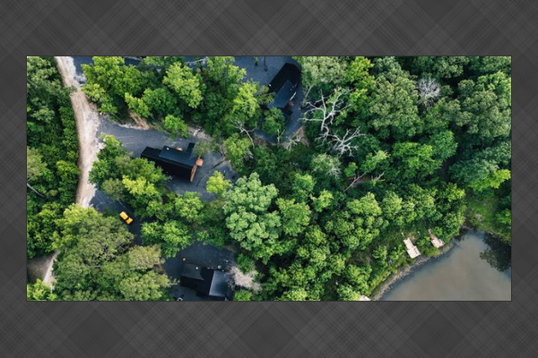 Aerial view showcasing the wooded setting