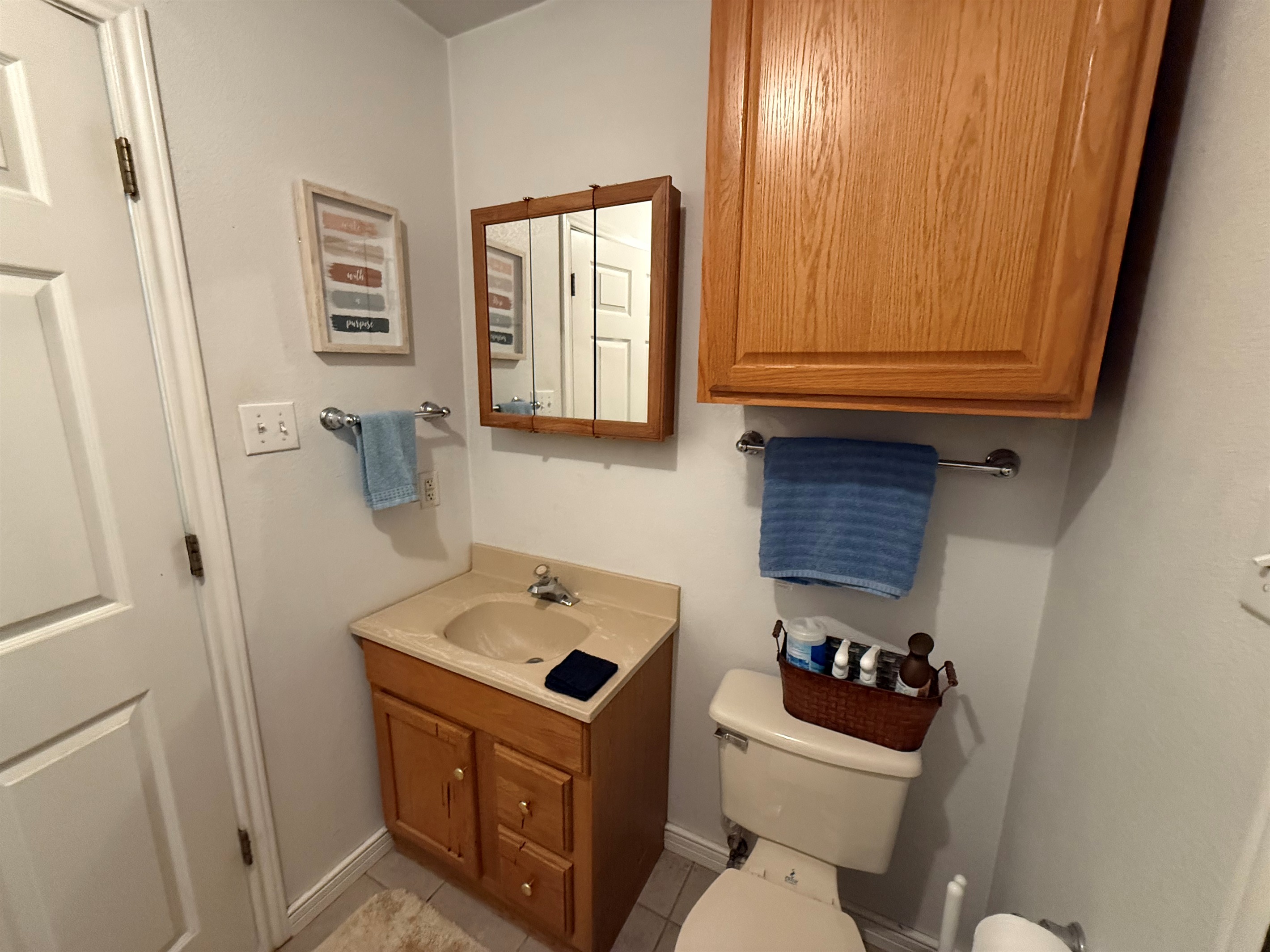 Well-lit vanity with toiletries provided.