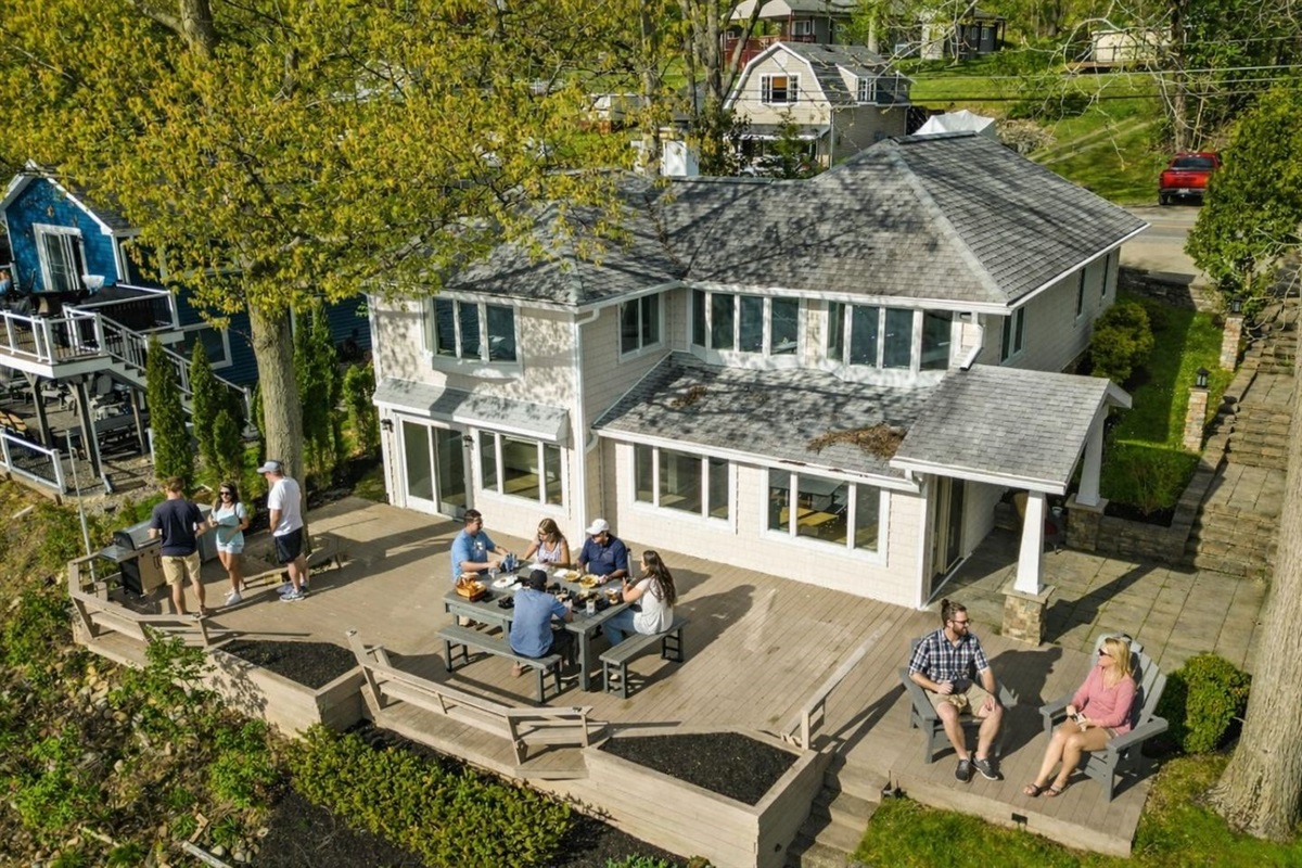 Beautiful lakeside retreat with expansive deck and panoramic views. Perfect for family gatherings, BBQs, and outdoor relaxation. Enjoy the tranquility and charm of this stunning getaway!