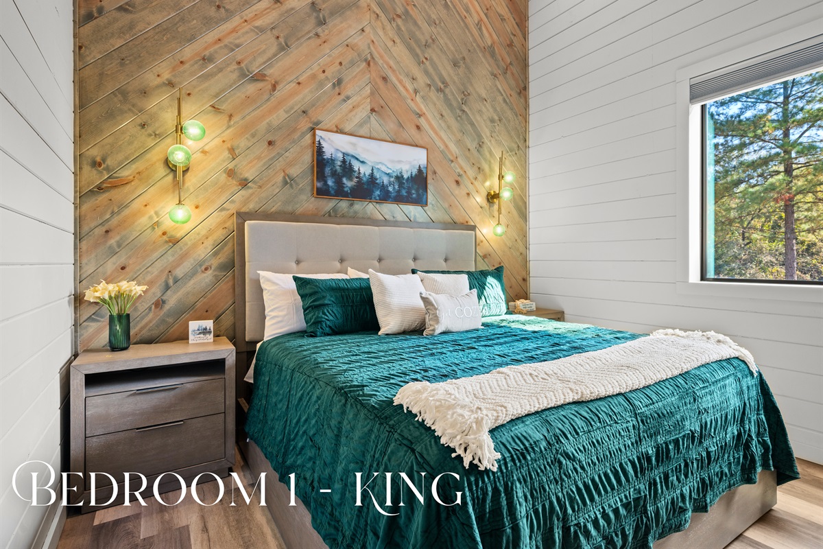 This serene king bedroom combines rustic textures and rich wood accents with soft lighting, creating a peaceful retreat that feels both cozy and elegant.