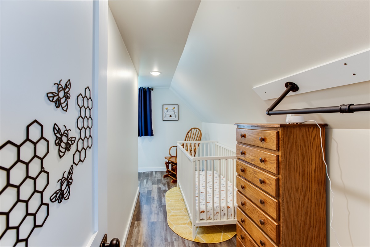 Bedroom 3: This spacious walk-in closet features clothing storage, a crib & rocking chair plus a desk.