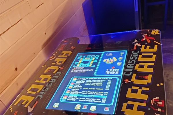 Game Room: Immerse yourself in retro fun with our classic arcade gaming table!

