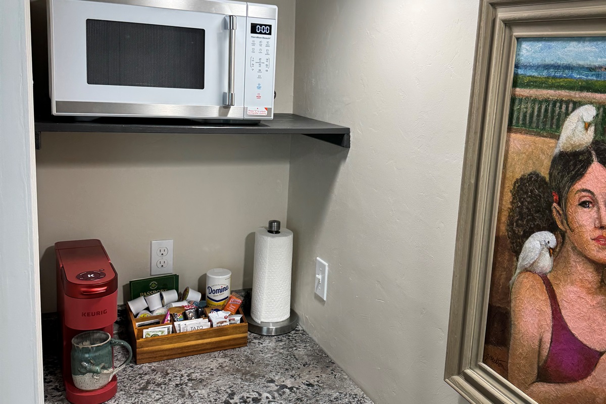 Coffee bar is fully stocked for you with Keurig coffee pods, sugar, creamer, tea bags and snacks. We also have a regular coffee pot available if you prefer. 