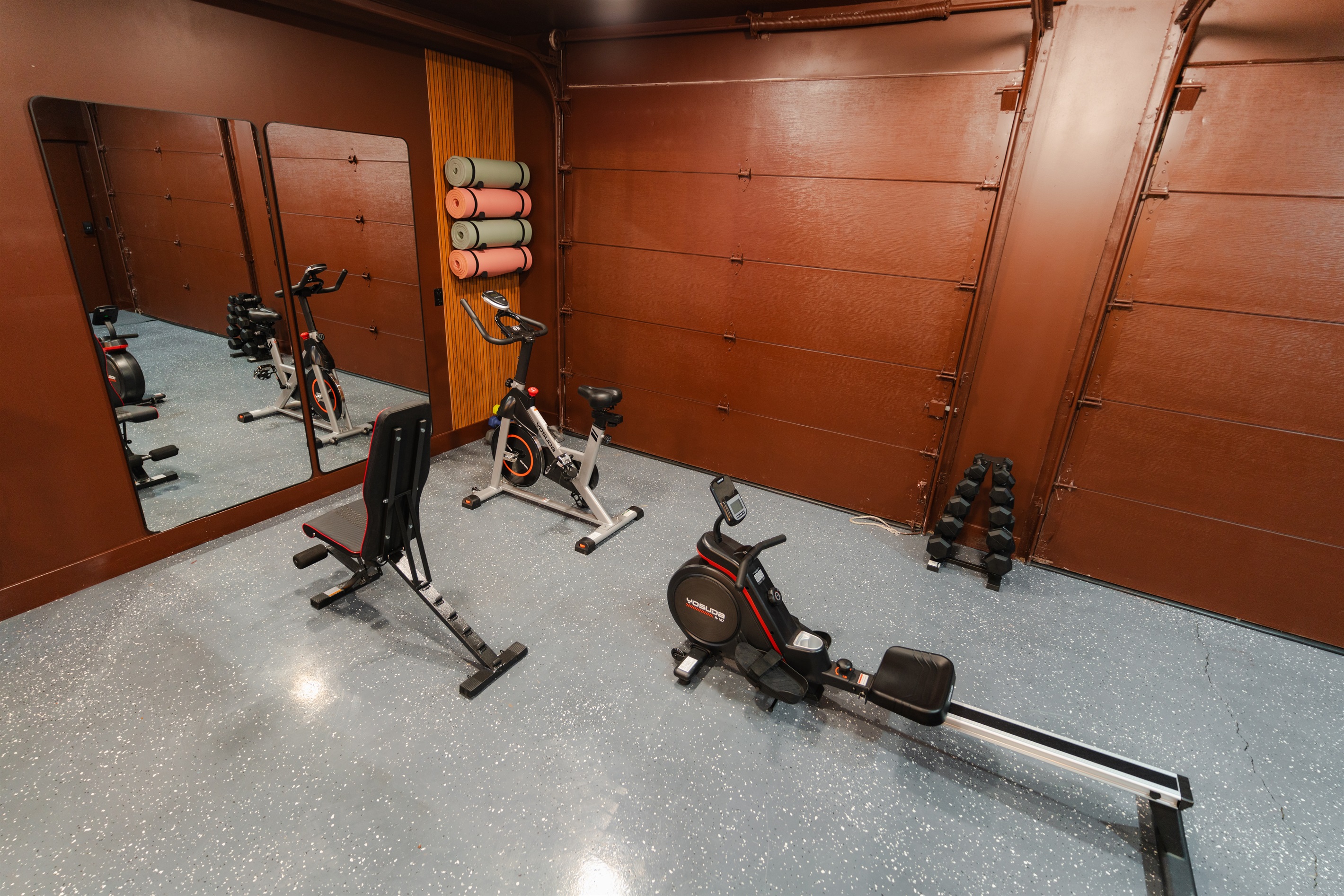 Stay on track with your workouts using this private fitness space with cardio and strength equipment.