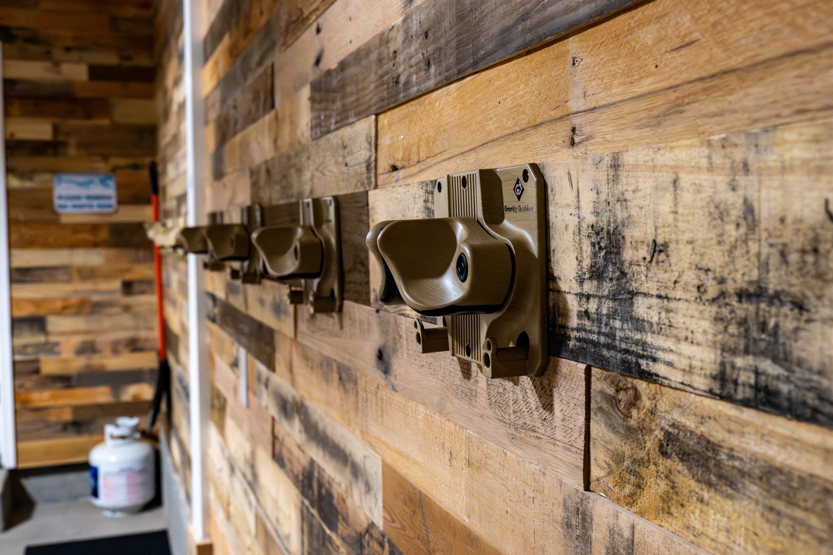 Wall-mounted ski racks and gear hooks for easy organization.